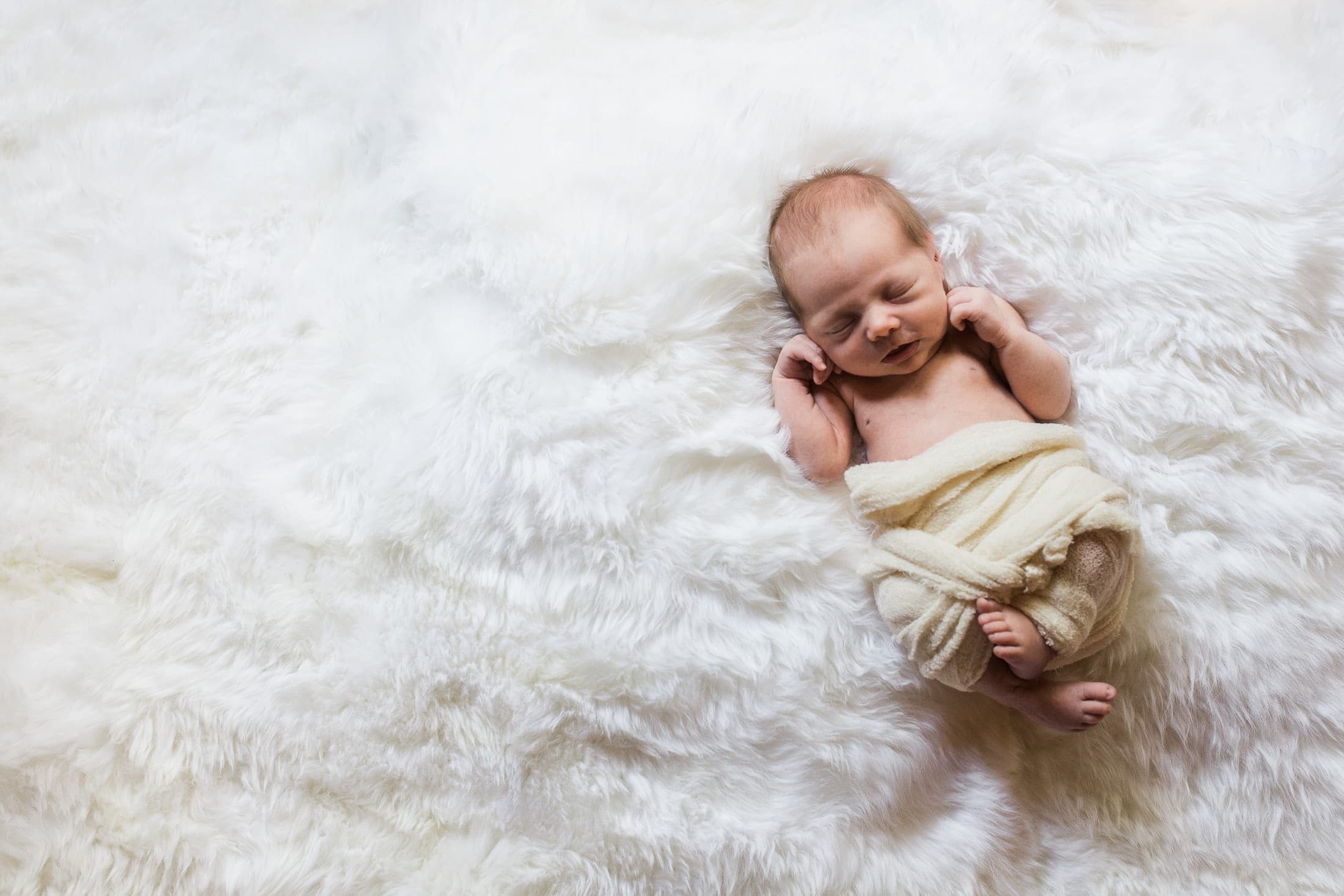 Sleeping baby on rug