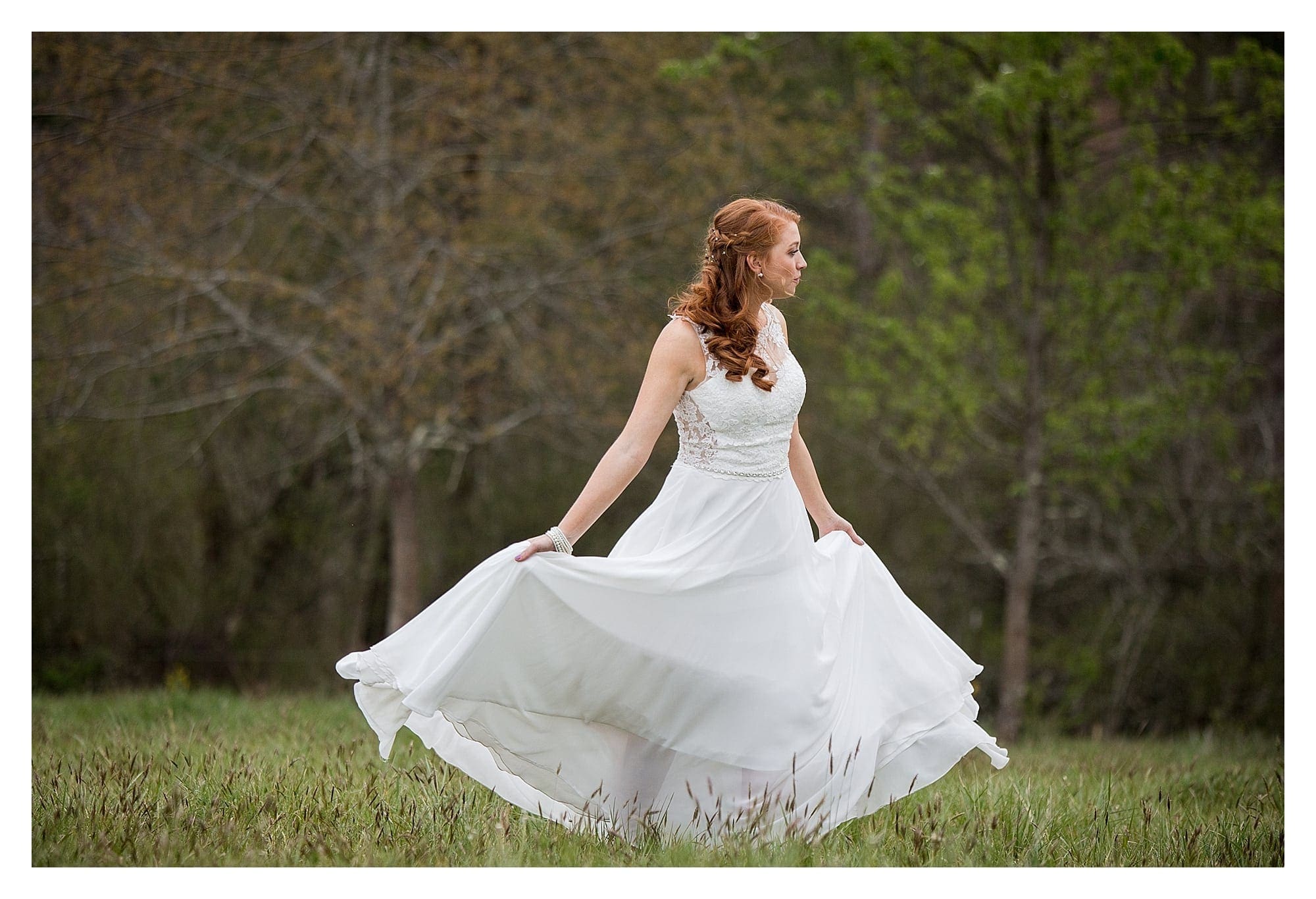 Bride in field spinning in dress