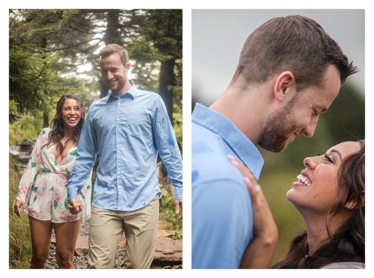 Young couple holding hands walking down forest trail on cloudy day