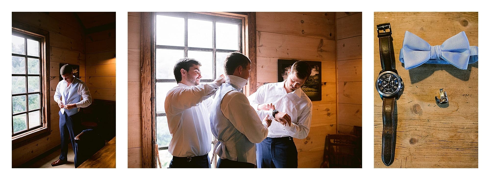 Groom getting ready buttoning up suit in wooden cabin room