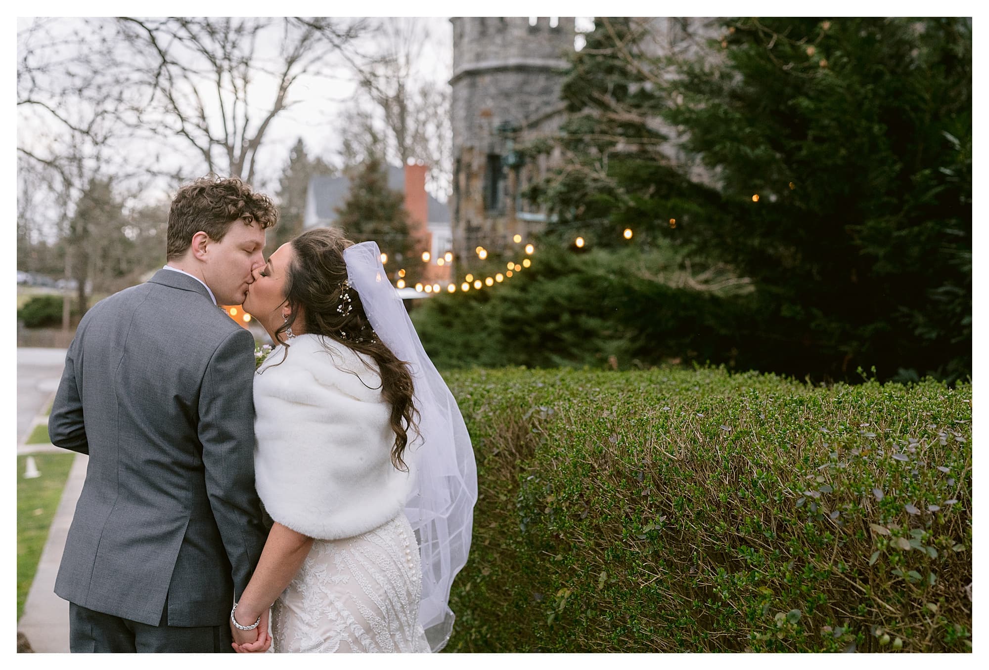 Couple walking down path to wedding venue