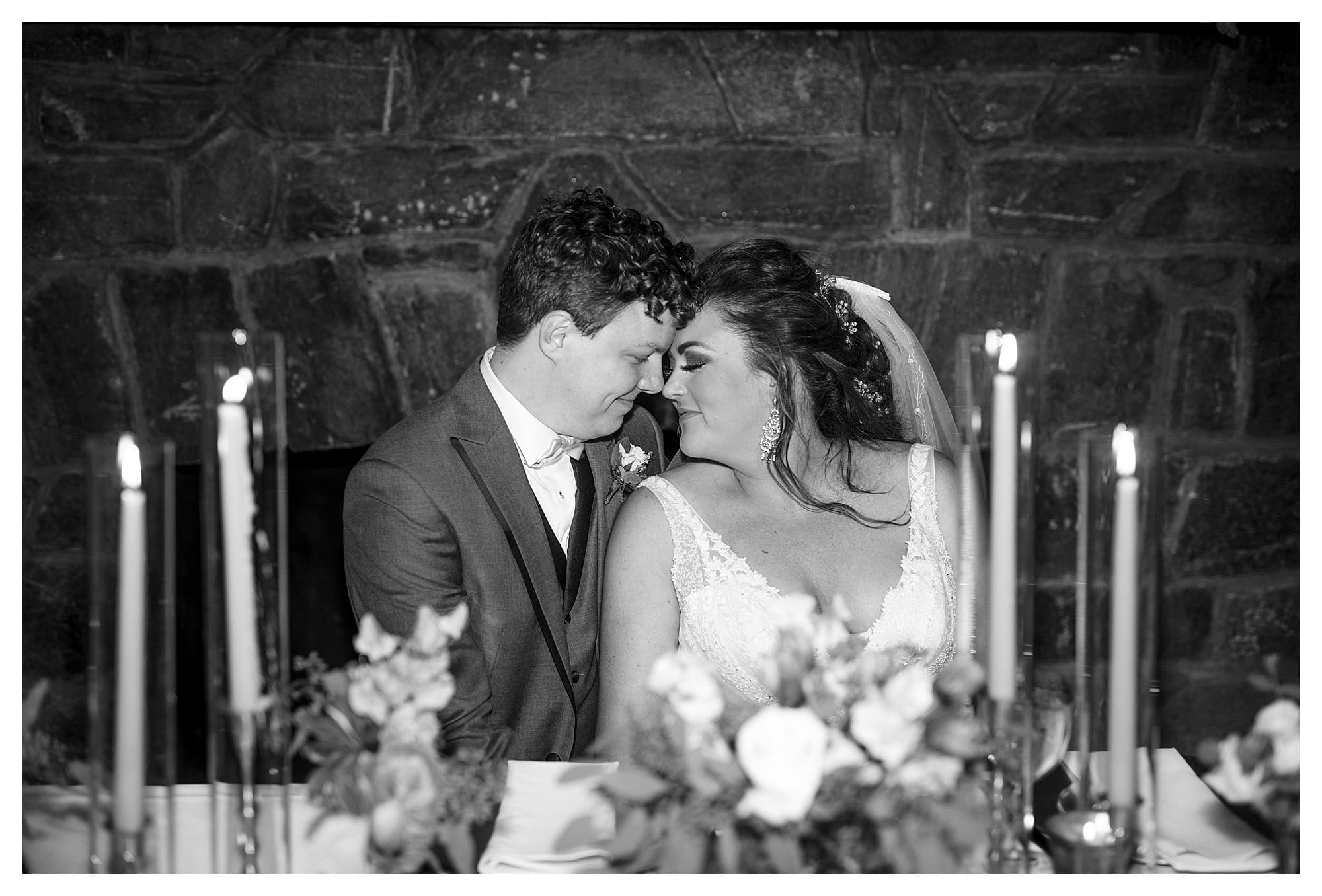 black and white photo of couple at head table 