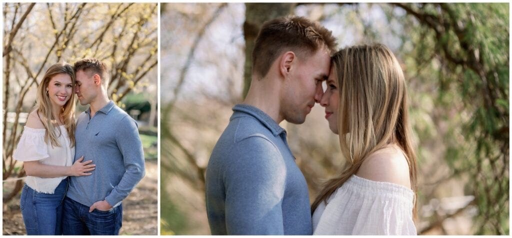 Couple snuggling close together in the trees at the NC Arboretum in Asheville.