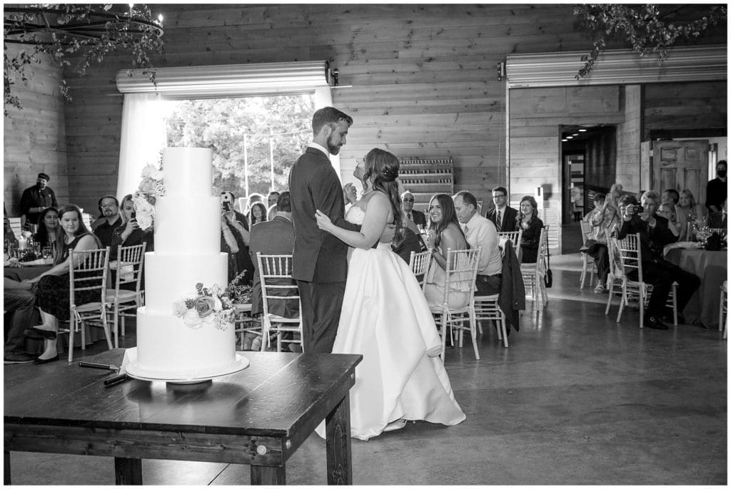 The bride and groom share a first dance together at Honeysuckle Hill after their wedding ceremony.