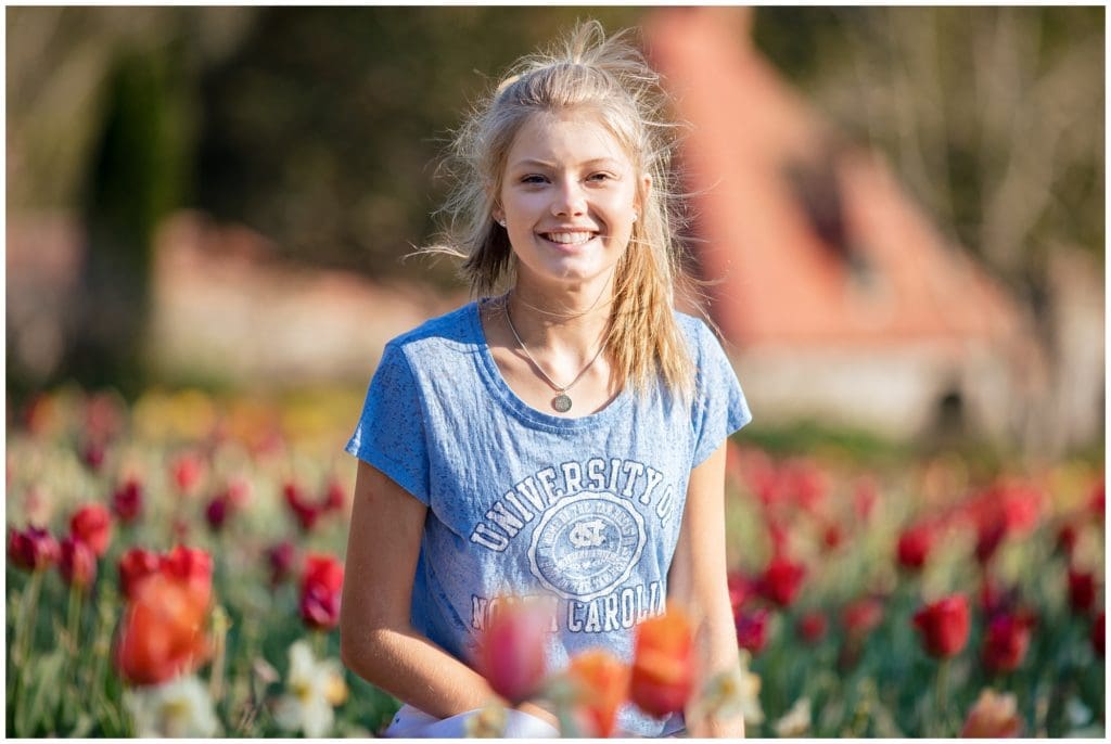 High School Senior portraits in a field of red tulips |  Asheville NC Senior Photographer | Kathy Beaver Photography