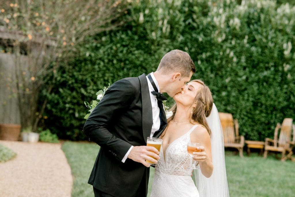 The bride and groom share a drink a cocktail hour | Kathy Beaver Photography | Asheville Wedding Photographer
