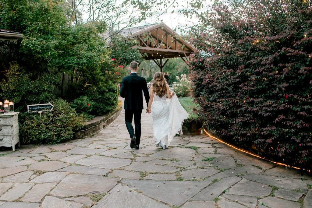 The bride and groom walk to cocktail hour | Kathy Beaver Photography | Asheville Wedding Photographer