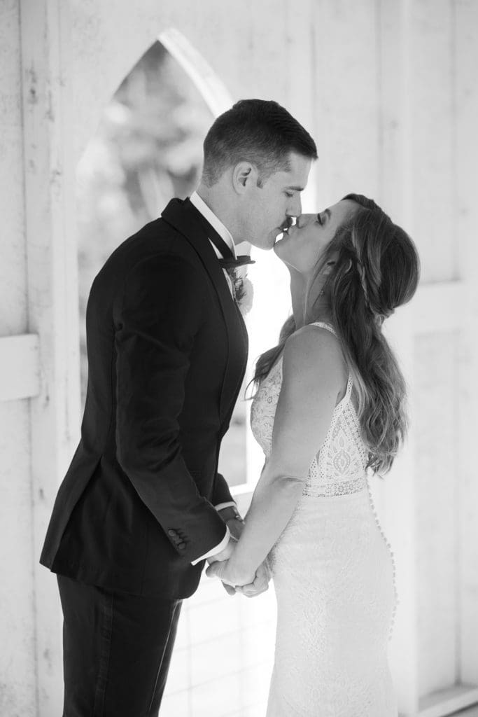 The bride and groom share a kiss after their first look | Kathy Beaver Photography | Asheville Wedding Photographer
