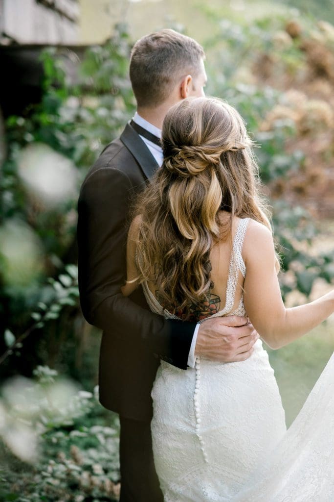 The groom hugs his bride | Kathy Beaver Photography | Asheville Wedding Photographer
