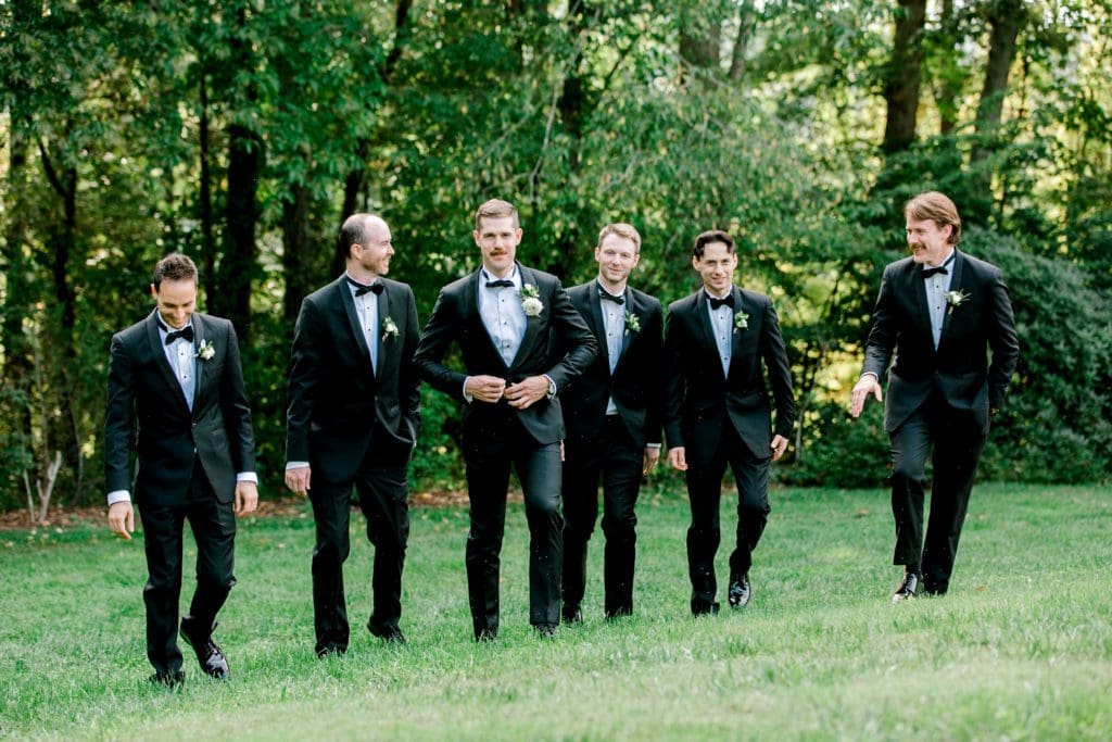 The groom with his groomsmen walking toward the camera | Kathy Beaver Photography | Asheville Wedding Photographer