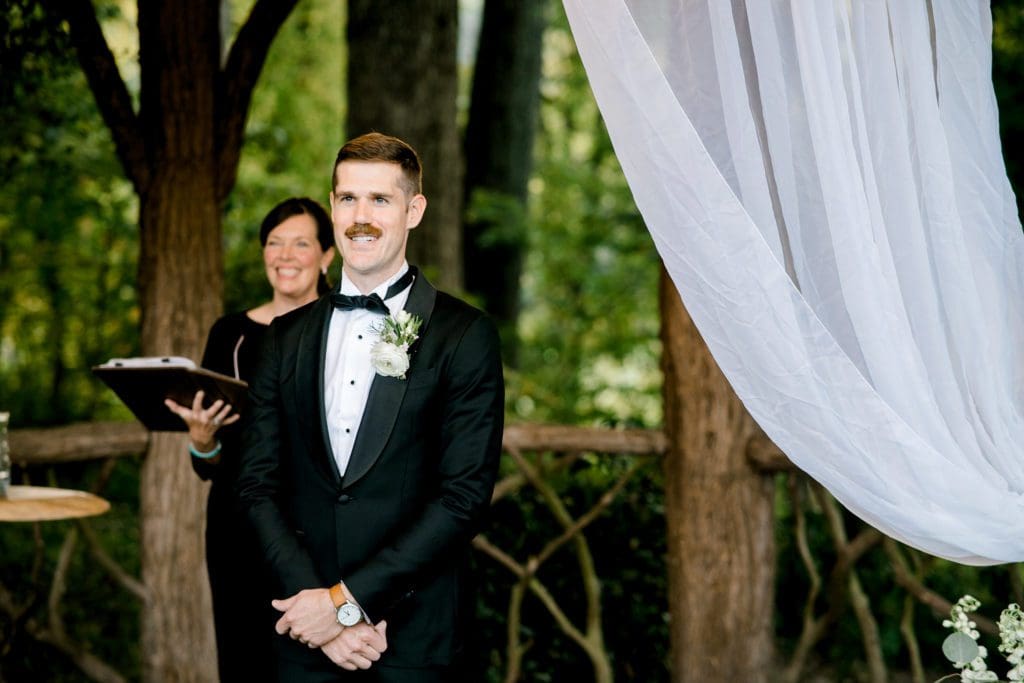 The groom smiles as his bride walks down the aisle | Kathy Beaver Photography | Asheville Wedding Photographer