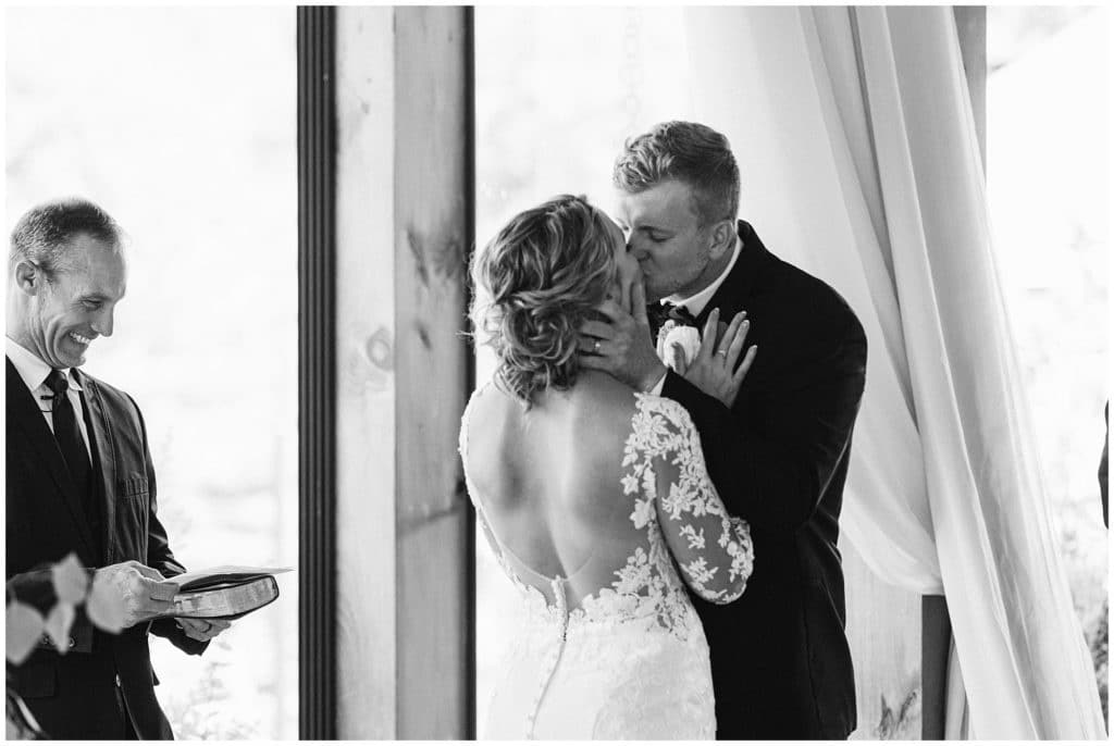 Black and white first kiss at the wedding ceremony  | Asheville Wedding Photographer | Kathy Beaver Photography