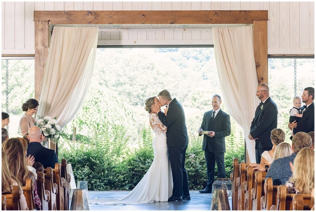 First kiss at ceremony  | Asheville Wedding Photographer | Kathy Beaver Photography