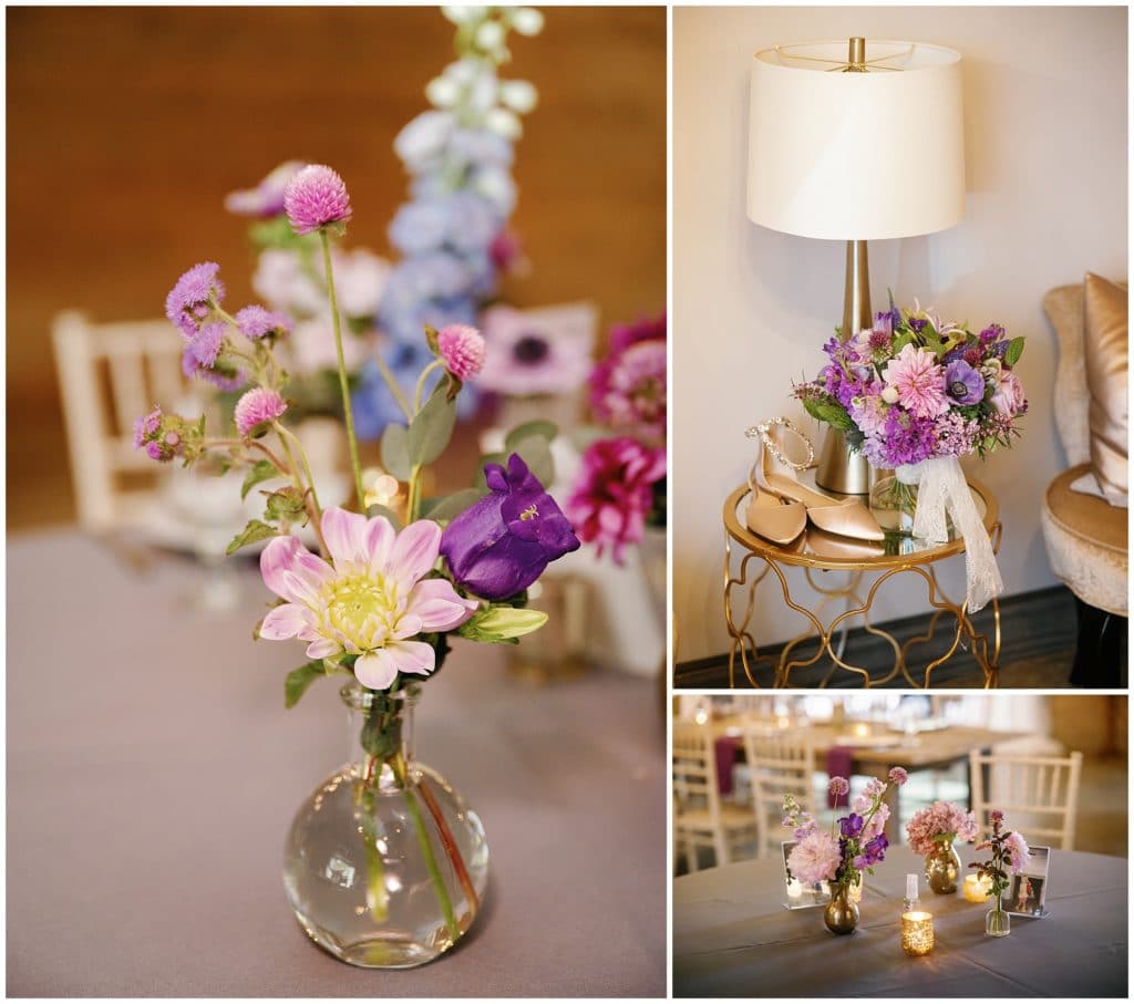 Small jars of purple flowers and greenery decorated the wedding reception barn  | Asheville Wedding Photographer