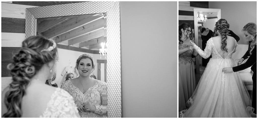 The bride looks at herself in the mirror for the first time  | Asheville Wedding Photographer