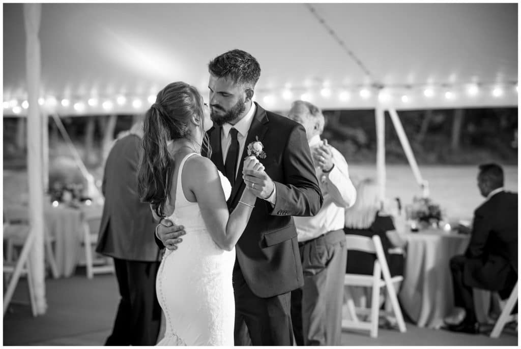 Black and white photo of couple sharing a dance at their spring wedding at Junebug Retro Resort in Weaverville, NC