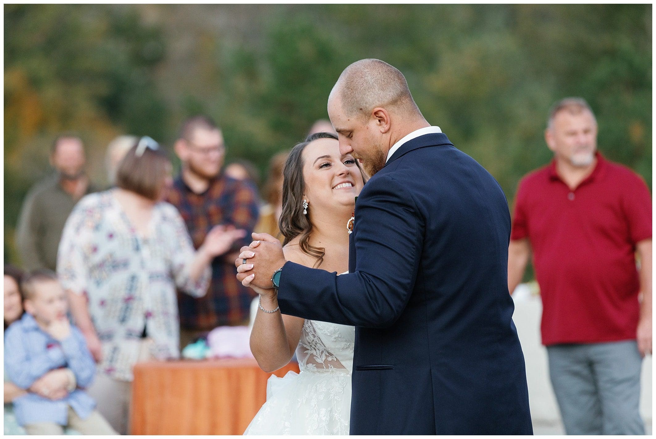Couple shares first dance outdoors
