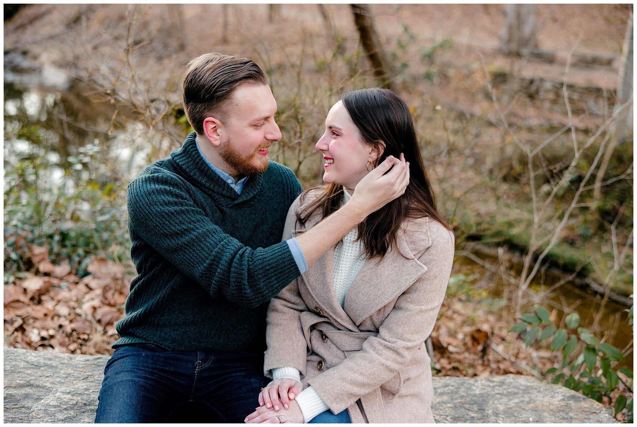 couple poses for engagement session at the Asheville botanical gardens