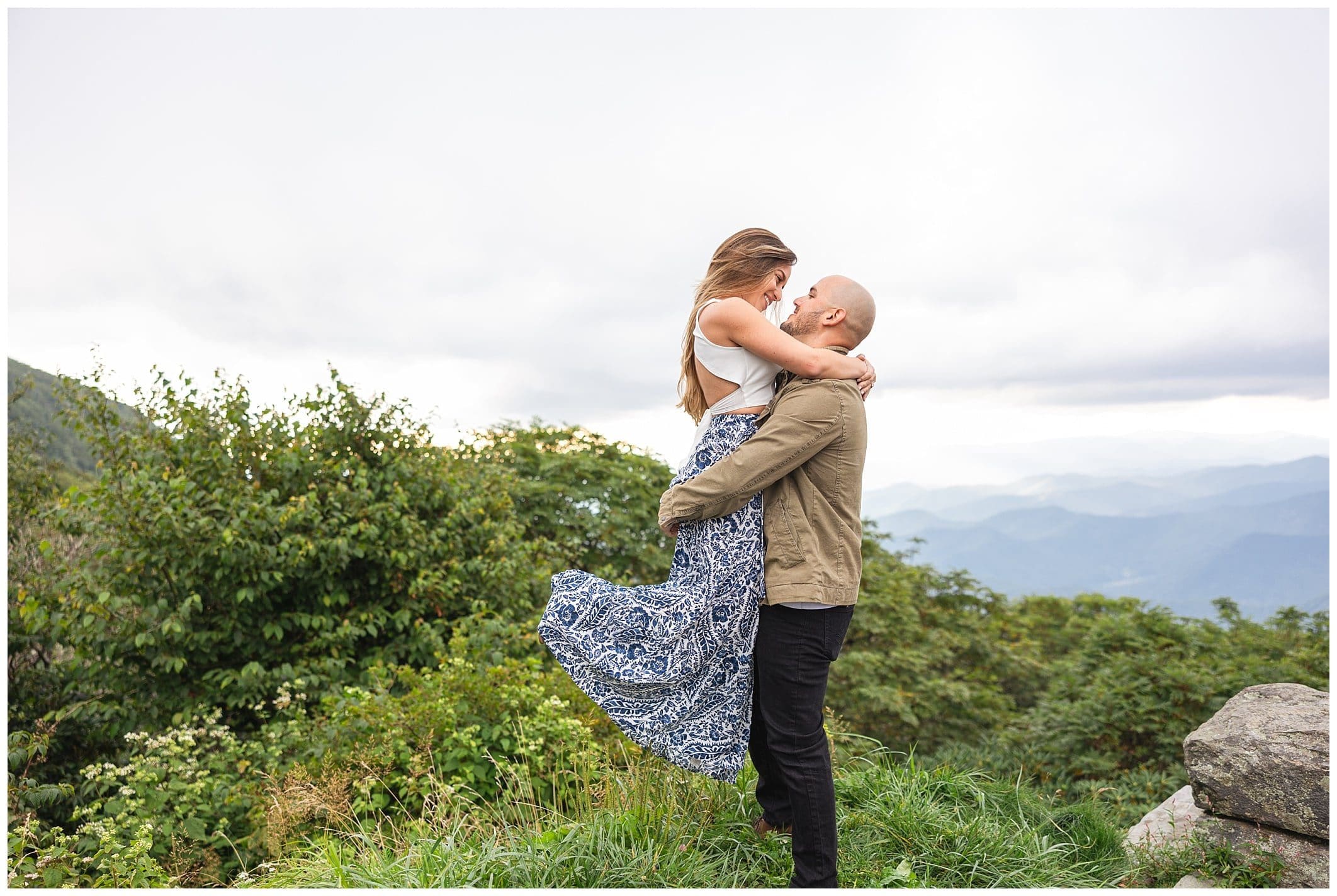 Couple embraces one another for their Blue Ridge Parkway engagement session