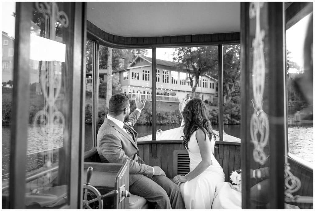 Bride and groom on a small wooden charter boat