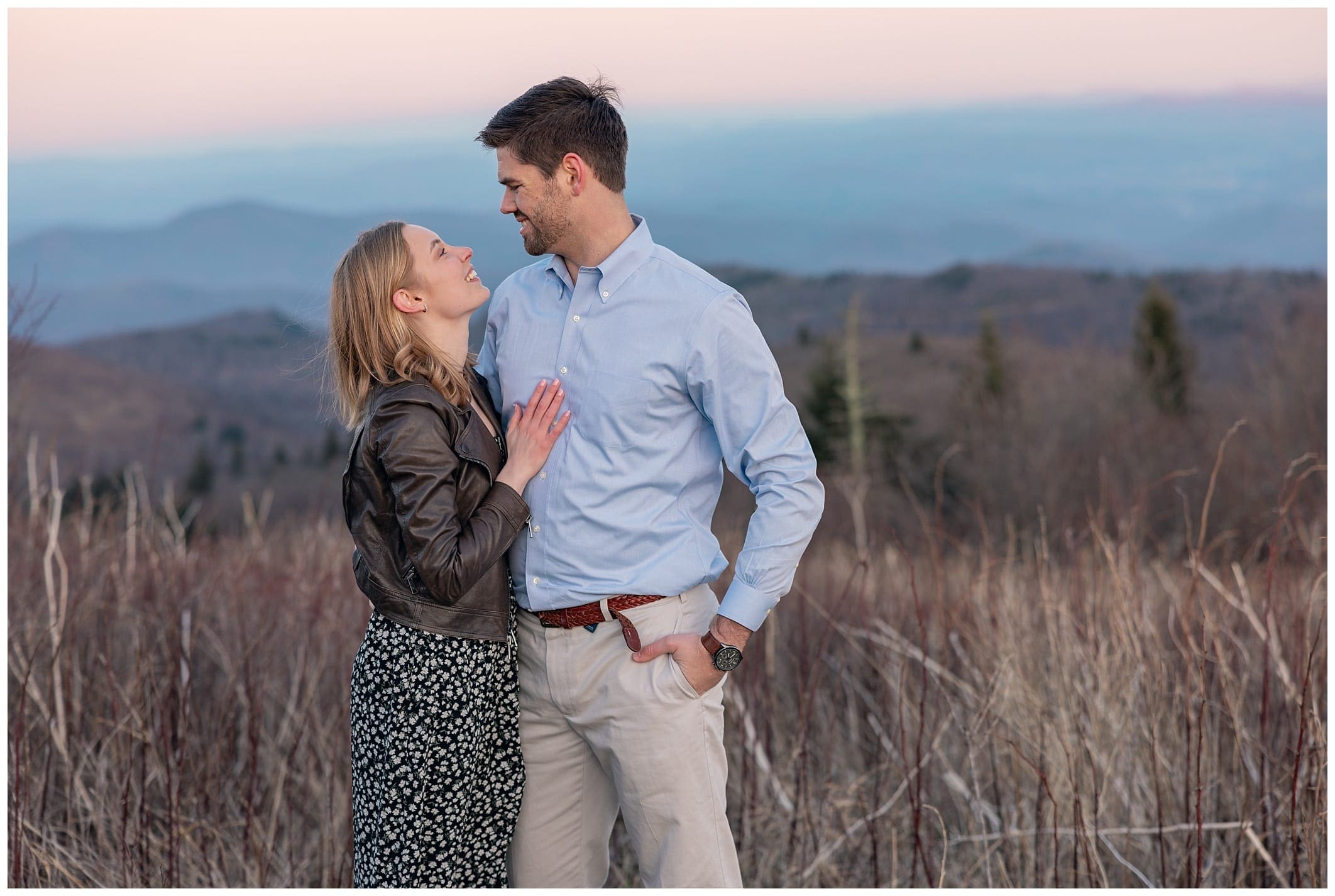 couple poses with mountain views for their Black Balsam engagement session