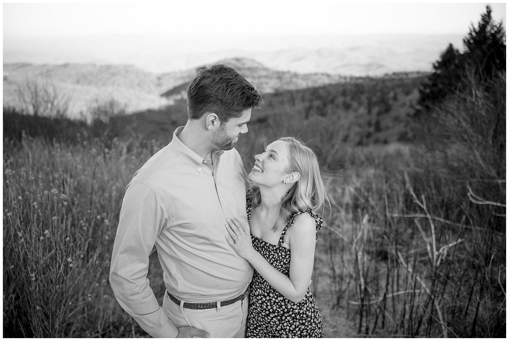 black and white photo of couple posing for their Black Balsam engagement session