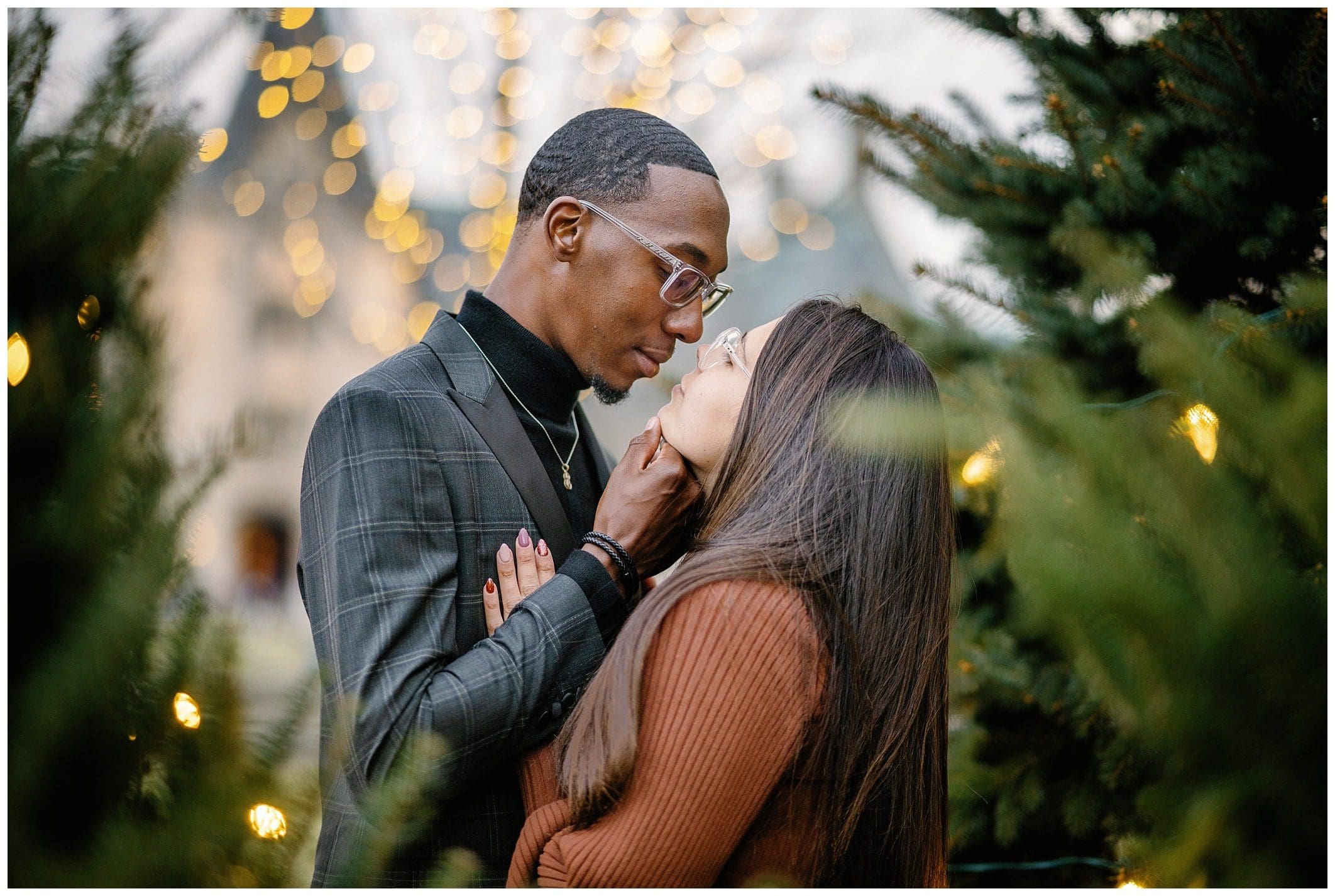 couple shares kiss at the Biltmore Estate for their winter engagement session