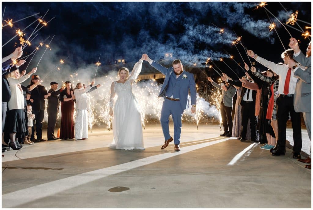 bride and groom share sparkler exit