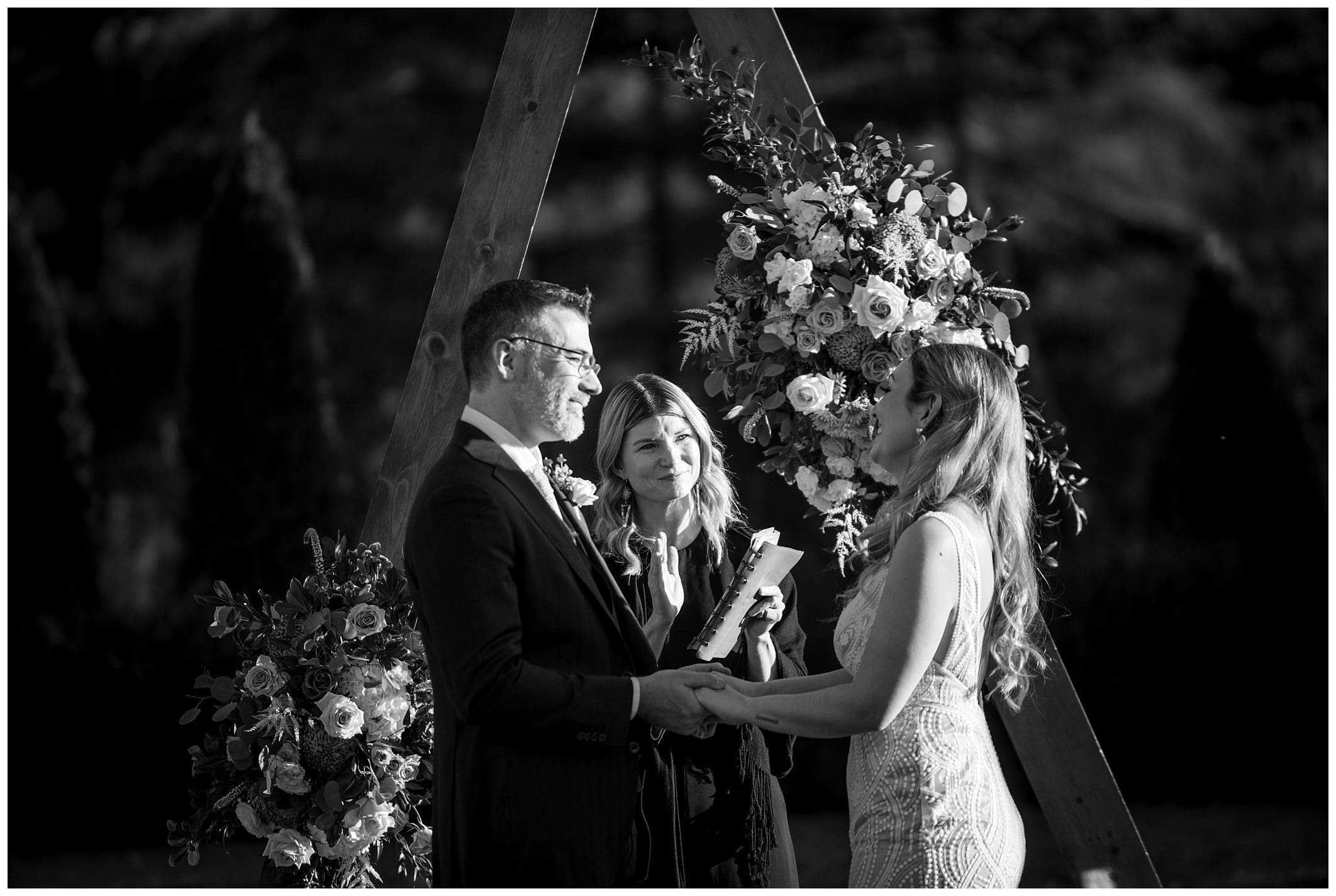 black and white ceremony photo of bride and groom in the North Carolina mountains