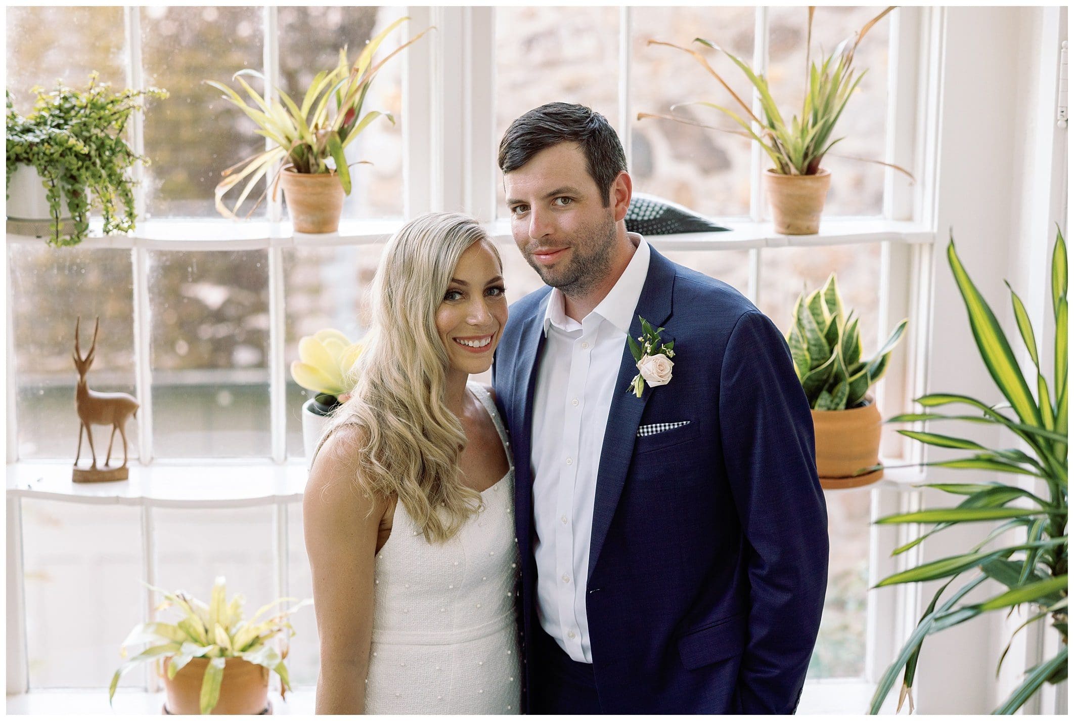 bride and groom pose for intimate mountain wedding