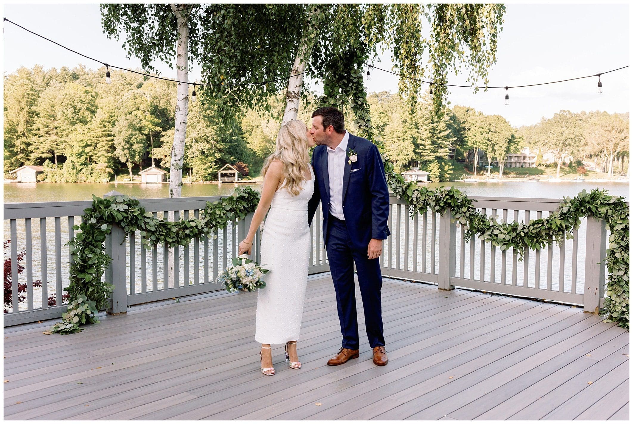 bride and groom kiss for intimate mountain wedding