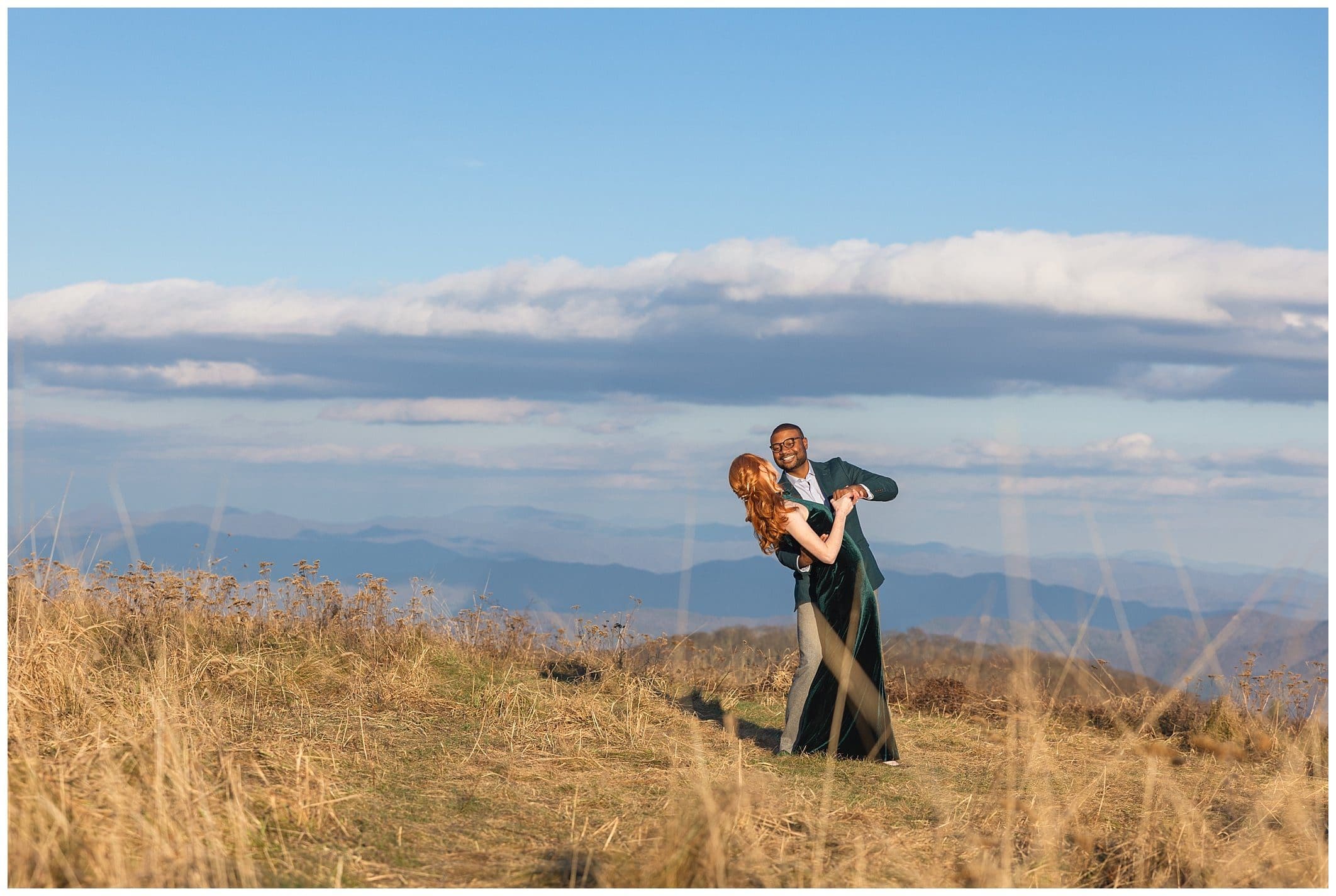 couple shares mountaintop photo for their winter engagement
