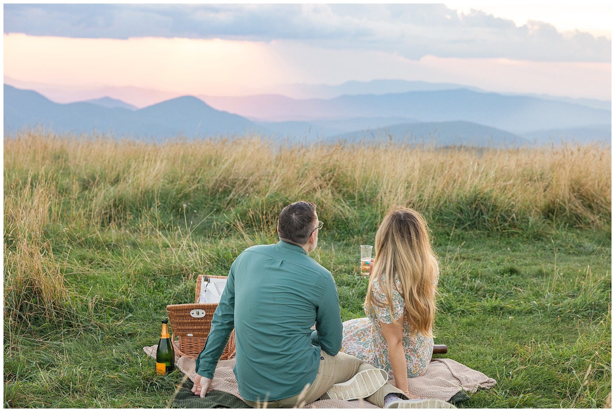 couple poses for sunset mountain engagement session in Asheville North Carolina