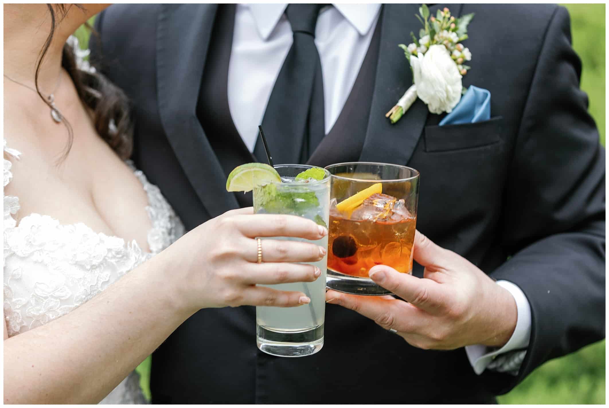 Bride and groom holding signature drinks 