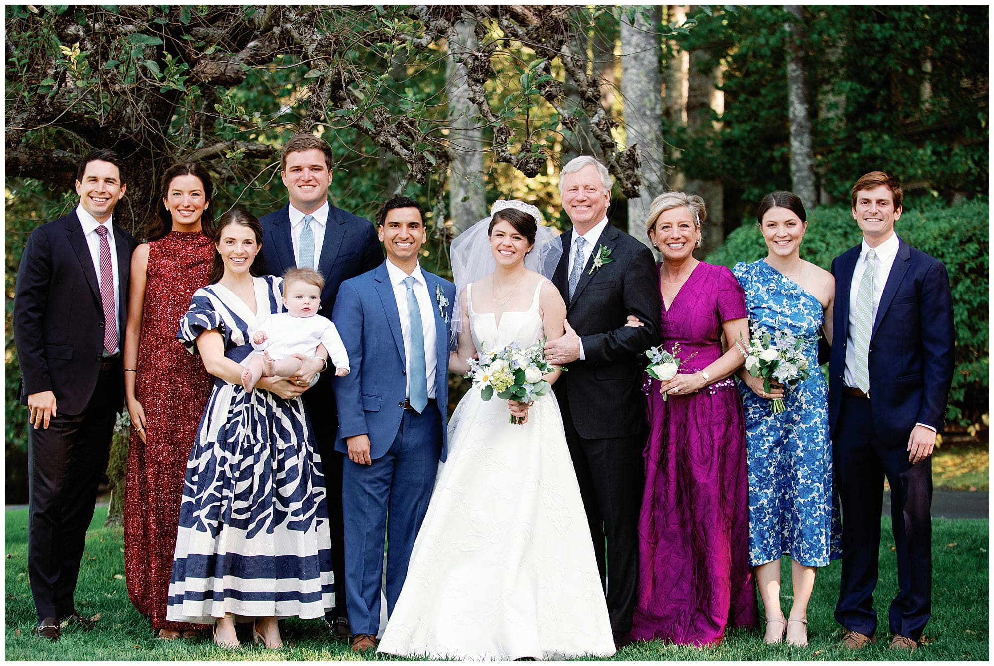 A wedding party posing for a photo.