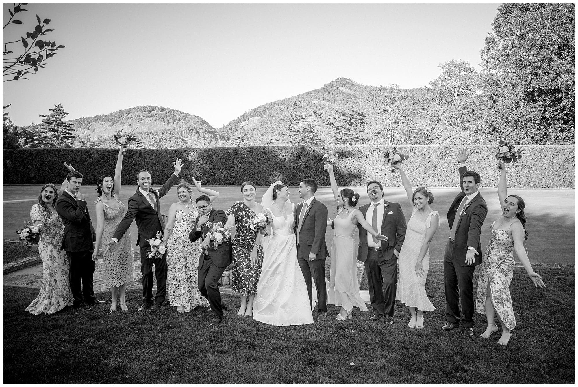 A black and white photo of a wedding party.