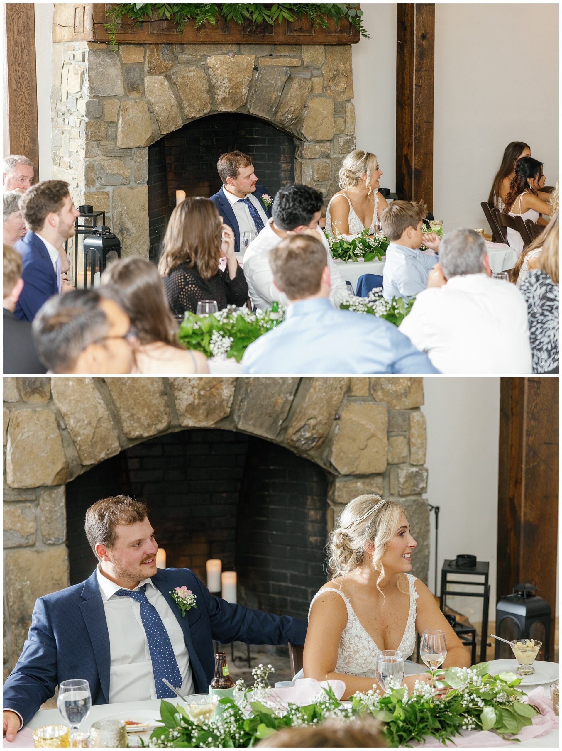 A bride and groom sitting at a table in front of a fireplace.