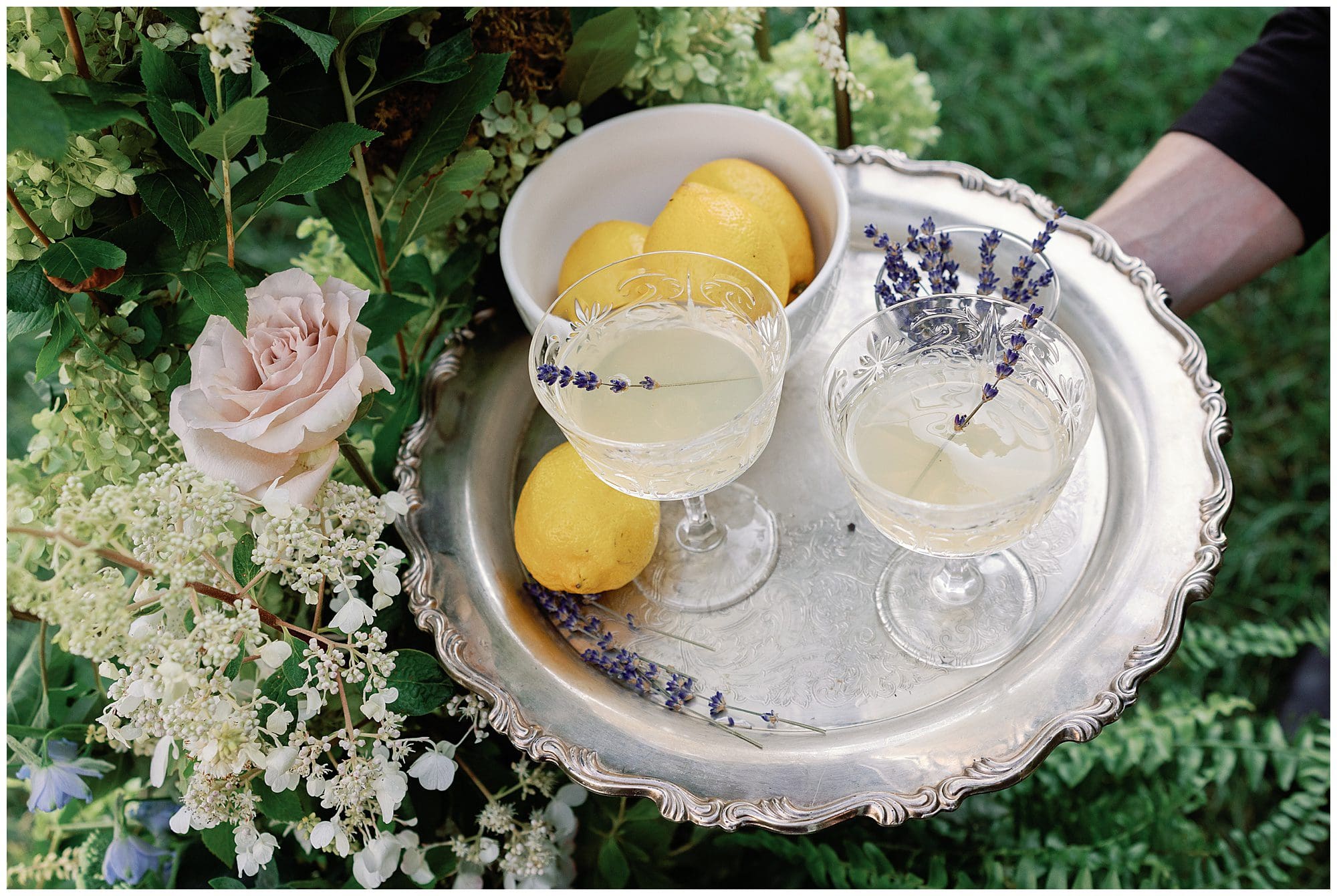 Two Parisian-inspired glasses of lemonade on a silver tray at a summer wedding at The Ridge.