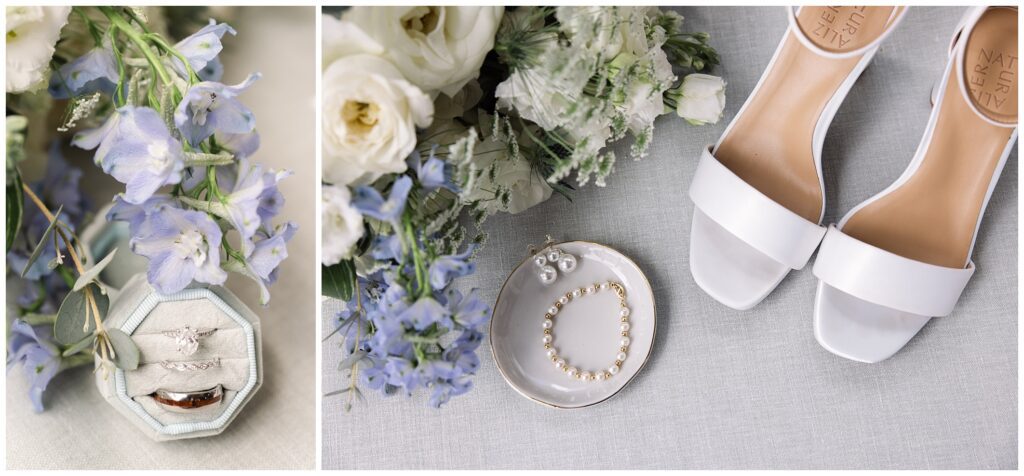 Wedding items including rings in a box, a bouquet, white high-heeled shoes, and a dish with pearl jewelry arranged on a light-colored surface.