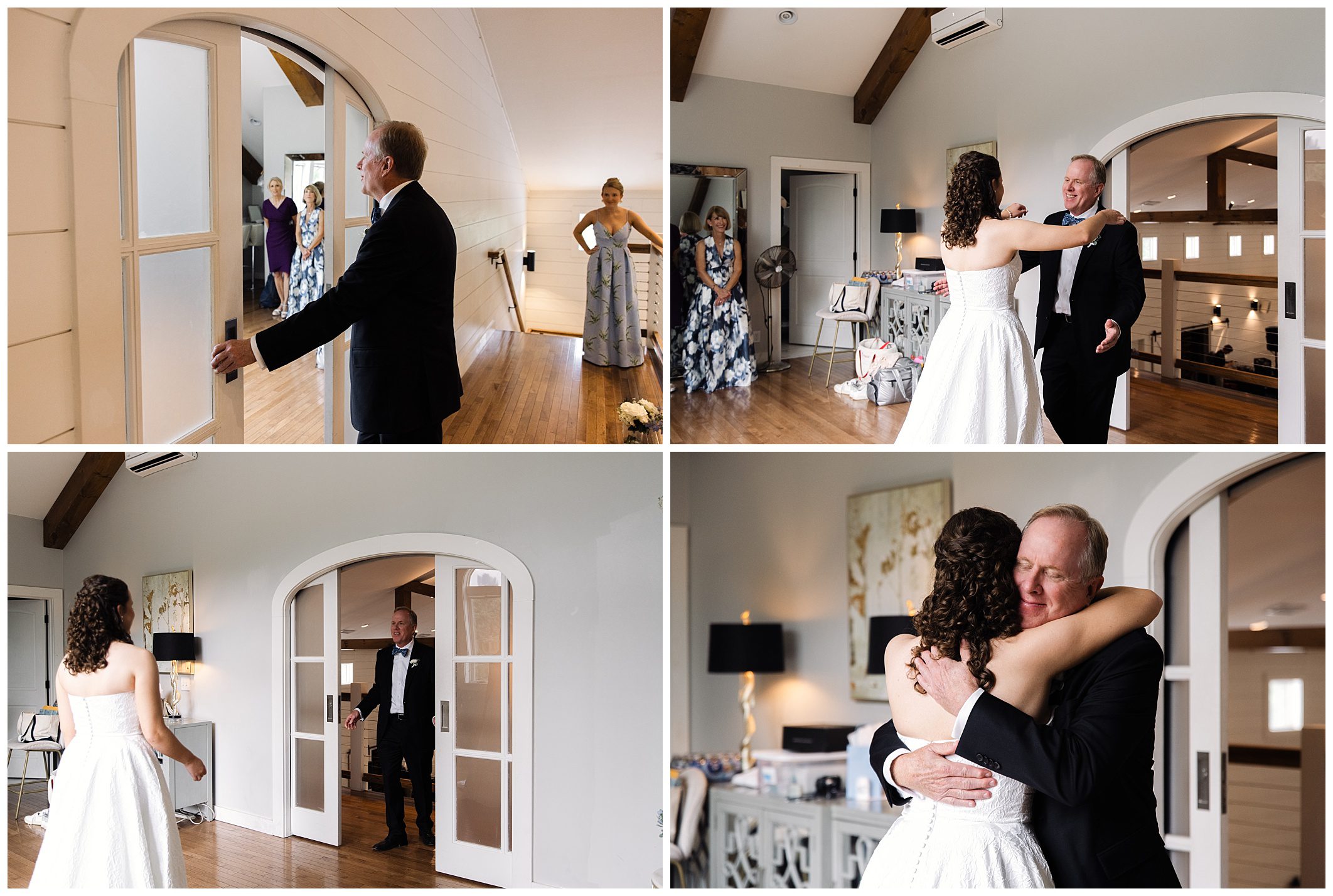 A bride in a white dress shares a first look moment with an older man in a suit. They embrace warmly, observed by people in the background. The interaction occurs in a modern, elegant room.