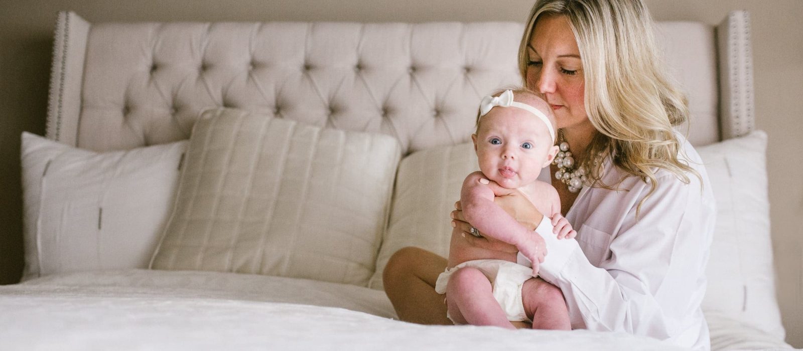 Mom and baby forehead kisses.