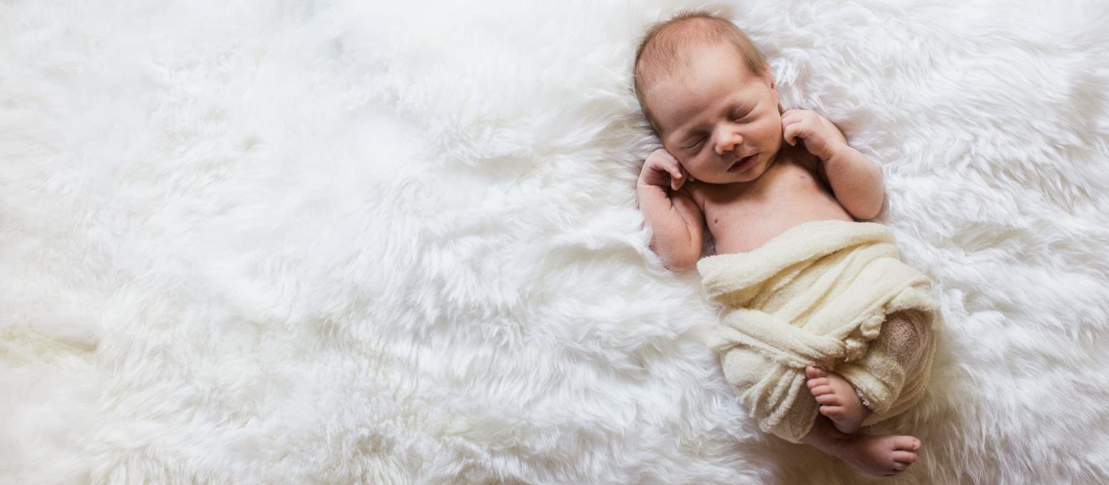 Sleeping baby on rug