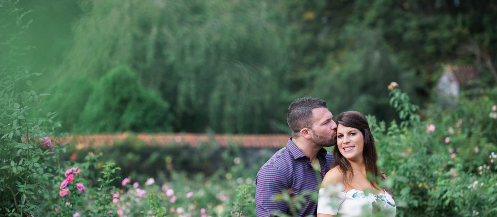 Couple in roses maternity pictures